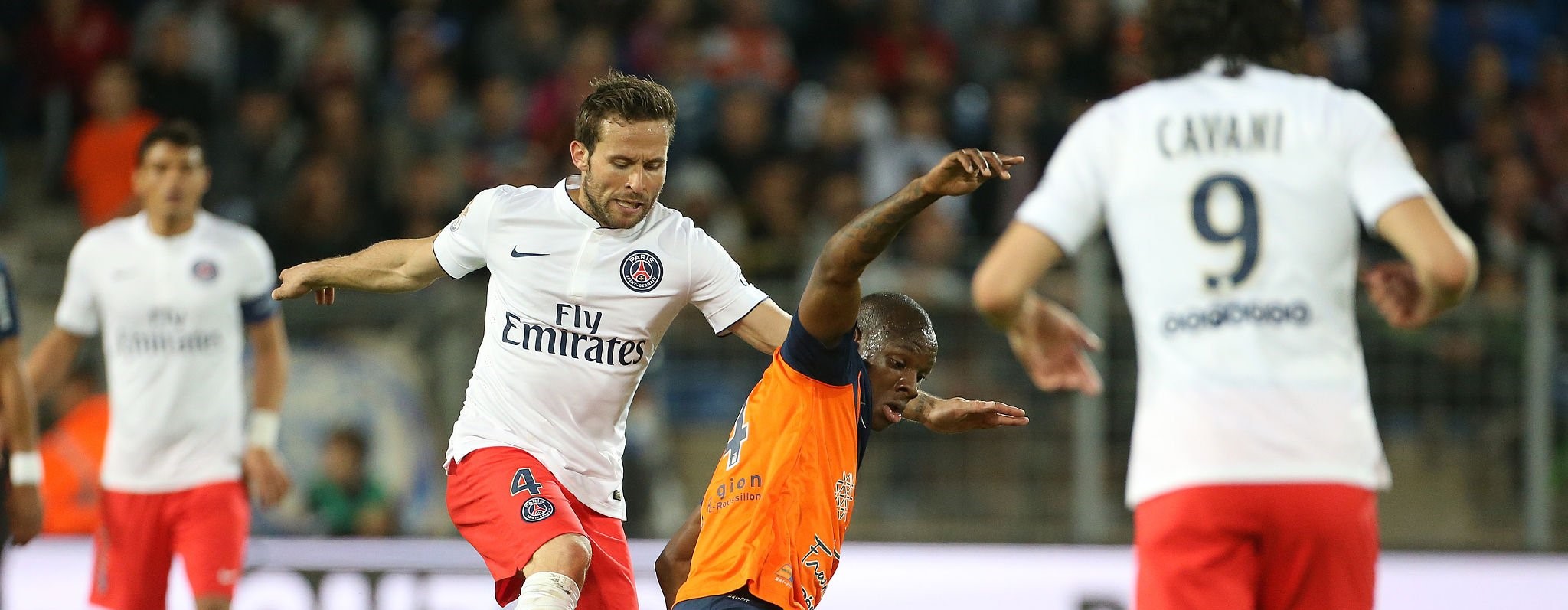 MONTPELLIER, FRANCE - MAY 16: Yohan Cabaye of PSG and Bryan Dabo of Montpellier in action during the French Ligue 1 match between Montpellier Herault SC (MHSC) and Paris Saint-Germain (PSG) at Stade de la Mosson on May 16, 2015 in Montpellier, France. (Photo by Jean Catuffe/Getty Images) 